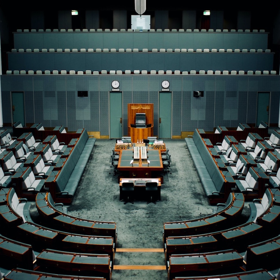 tables and chairs inside the hall